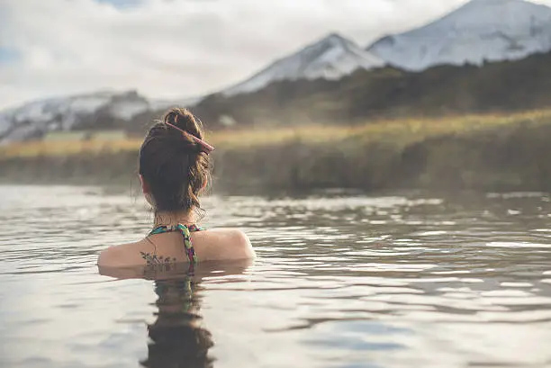 Photo of Girl in a hot spring in Iceland Landmannalaugar