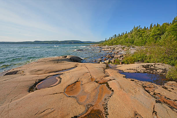 istock Water and Worn Rocks on a Lonely Coast 537598437