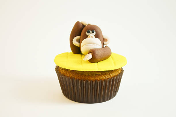 istock Cupcake with  a monkey figure made of fondant 537598727