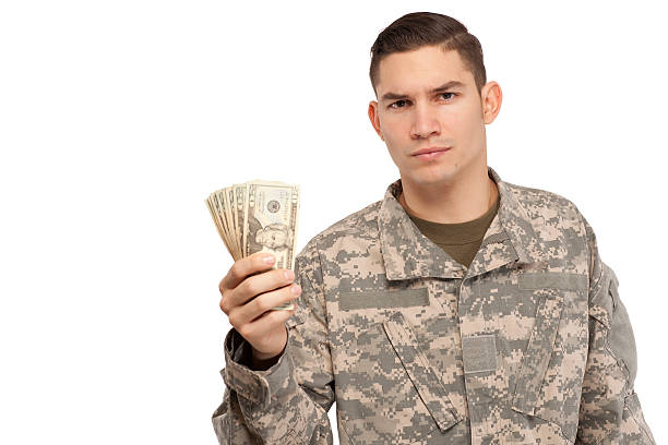 istock Soldier holding money 537598813