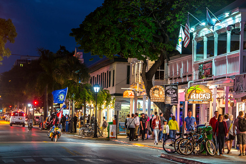 Key West, USA  - January 8, 2015: Key West streets by night. People walking, shopping and looking for a dinner