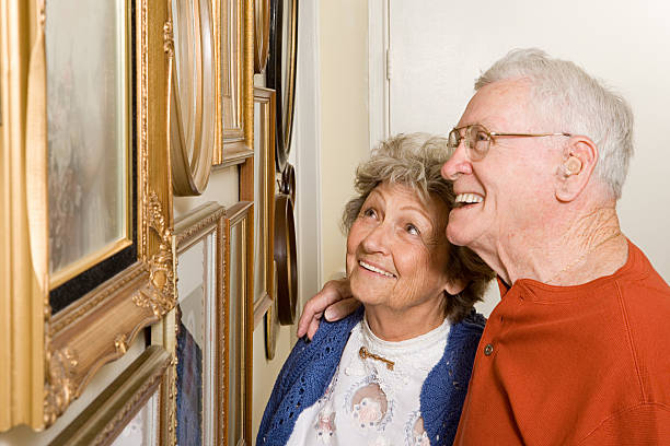istock Senior couple looking at photographs 537599313