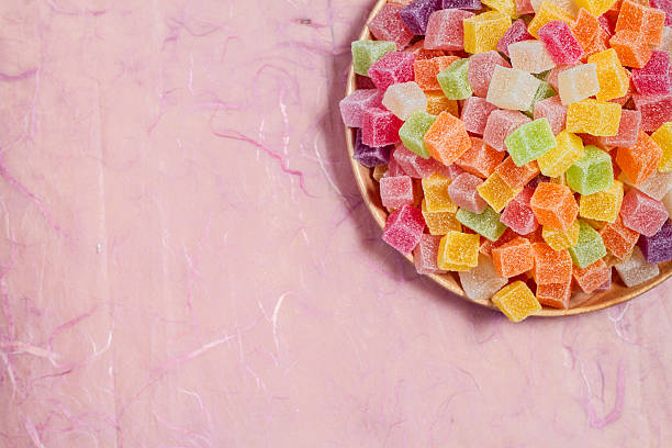 istock Candy and jelly colorful in dish on pink background 537599562