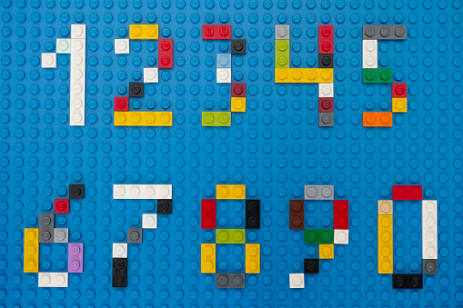 Tambov, Russian Federation - February 14, 2015: Lego custom numbers on Lego blue baseplate background. Studio shot.