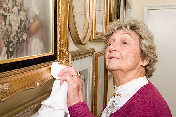 istock Woman polishing picture frames 537600037