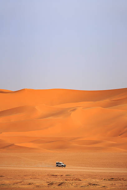 istock car driving in the Sahara Desert 537600172