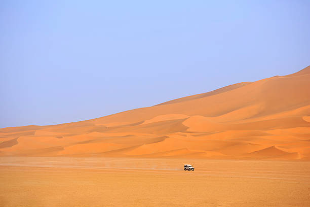 istock car driving in the Sahara Desert 537600404