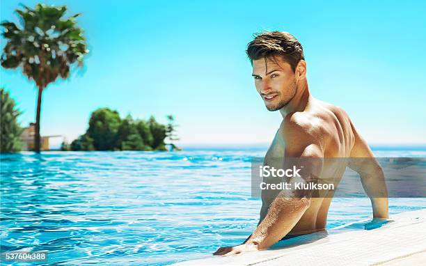 Portrait Of Handsome Man In Swimming Pool Stock Photo - Download Image Now - Men, Handsome People, Heat - Temperature