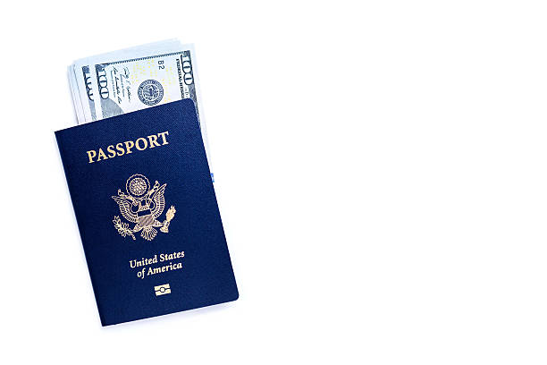 istock American passport with dollars 537604488