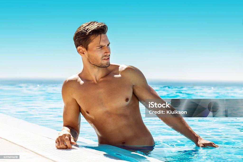 Handsome man in swimming pool Men Stock Photo