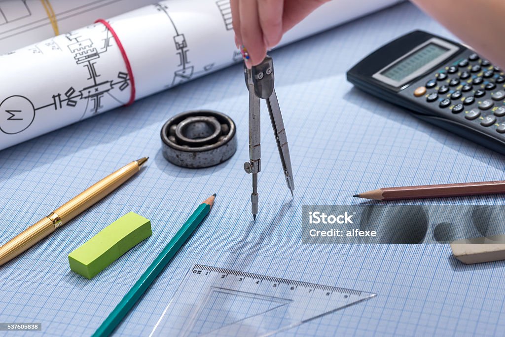 Engineering Graphics Compass Using Engineer Compass On Graph Paper With Engineering Drawing Tools ...