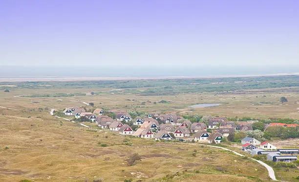 View at typical Dutch houses on island Ameland, The Netherlands