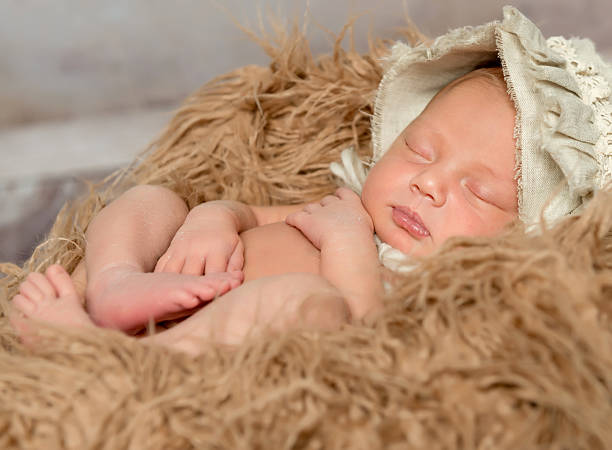 istock newborn baby sleeping on fluffy blanket 537606330