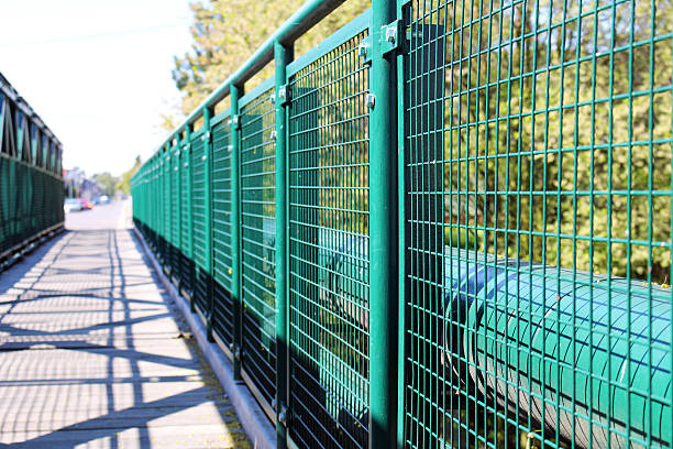 Detail of green railing at empty bridge stock photo