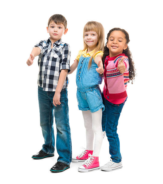 istock three smiling little children standing together 537608740