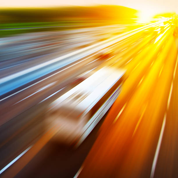 istock Motion blurred image of driving bus at sunset. 537608832