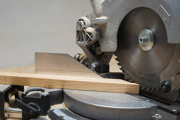 istock Carpenter tools on wooden table with sawdust. Circular Saw. 537608850