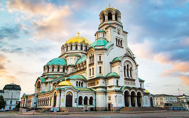 St. Alexander Nevski Cathedral in Sofia, Bulgaria St. Alexander Nevsky Cathedral in the center of Sofia, capital of Bulgaria against the blue morning sky with colorful clouds bulgarian culture photos stock pictures, royalty-free photos & images