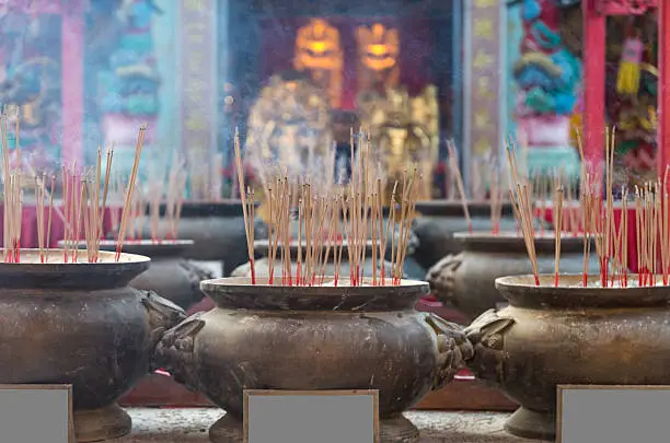 Burning incense in pot soft focus at Chinese temple