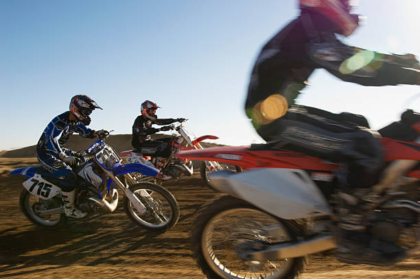 istock Motocross Racers Racing In Desert 537612053