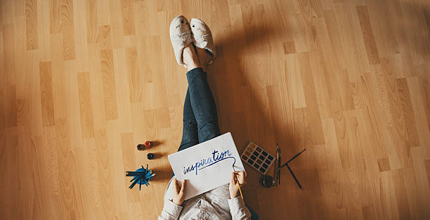 istock Creative workspace: girl hand drawing at home, on the floor. 537612242