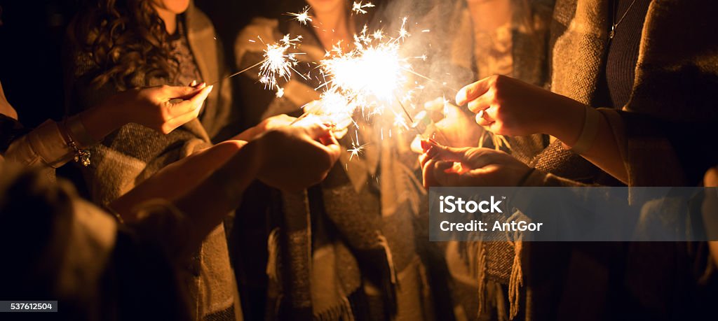 Women holding many sparklers in hands at night Firework - Explosive Material Stock Photo