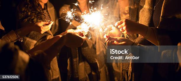 Women Holding Many Sparklers In Hands At Night Stock Photo - Download Image Now - Firework - Explosive Material, Firework Display, Sparkler - Firework