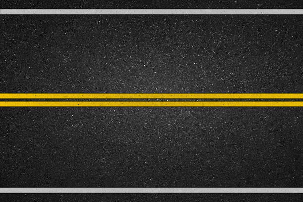 две желтые линии на асфальтовая дорога - асфальт стоковые фото и изображения