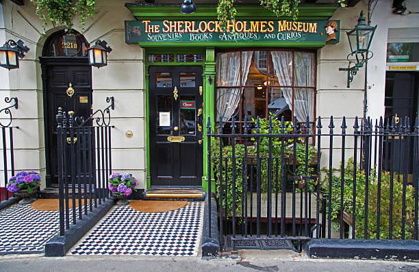London, UK - January 6, 2012: Tourist and a Policeman actor outside the Sherlock Holmes Museum at 221B Baker Street, the home of the famous fictitious Victorian private detective