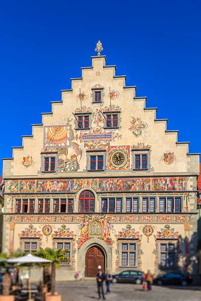 Lindau, Germany, June 23, 2023, Old town colorful houses and paintings on facade of old town hall building, a tourist magnet