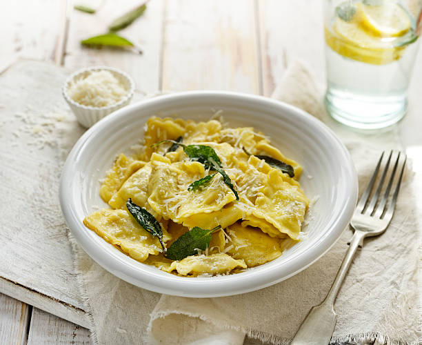 istock Ravioli with sage butter sprinkled with grana padano cheese 537619956