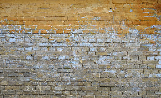 istock Old grunge brick wall with paint stains background 537620670