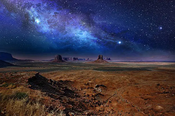 starry night sky over the monument valley