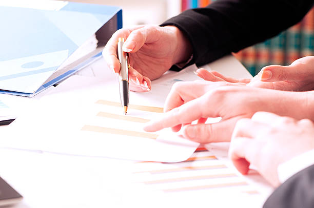 istock Business people analyzing business report with charts and diagrams 537622774