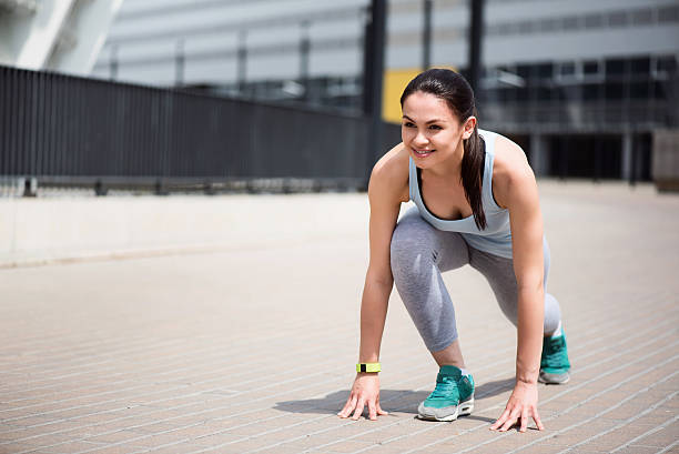 istock Woman at start position to run 537627724