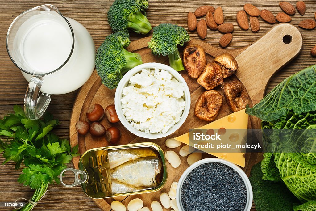 Foods rich in calcium Foods rich in calcium such as sardines, bean, dried figs, almonds, cottage cheese, hazelnuts, parsley leaves, blue poppy seed, broccoli, italian cabbage, cheese, milk Dairy Product Stock Photo