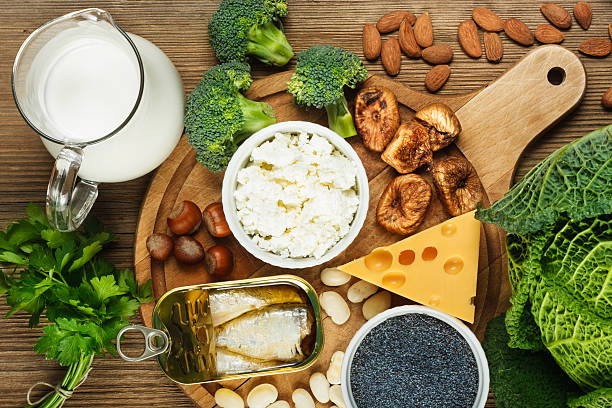 Foods rich in calcium Foods rich in calcium such as sardines, bean, dried figs, almonds, cottage cheese, hazelnuts, parsley leaves, blue poppy seed, broccoli, italian cabbage, cheese, milk calcium photos stock pictures, royalty-free photos & images