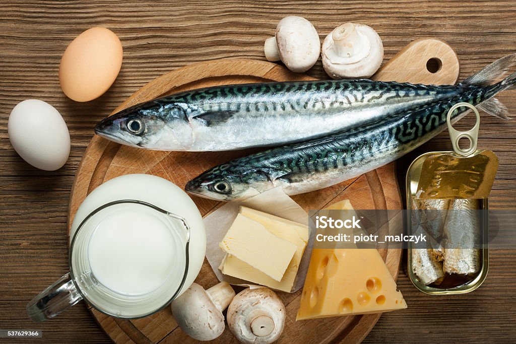 Foods rich in vitamin D Foods rich in natural vitamin D as fish, eggs, cheese, milk, butter, mushrooms, canned sardines Letter D Stock Photo