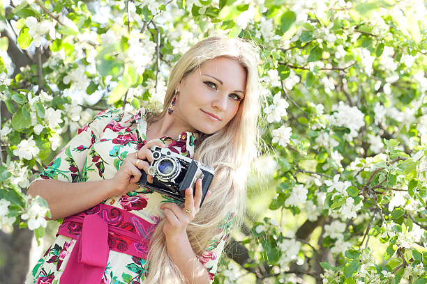 istock Woman with a retro camera 537629550