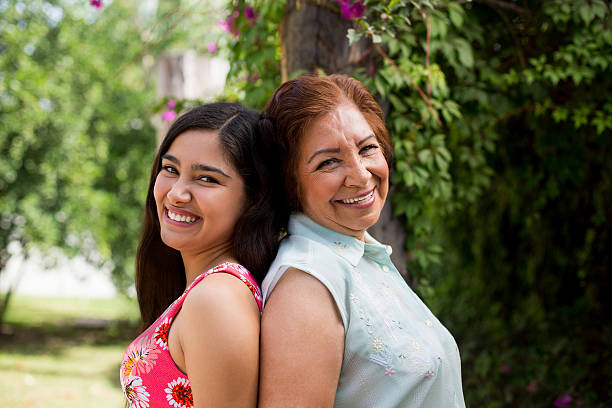 istock Grandmother and granddaughter back back 537630252
