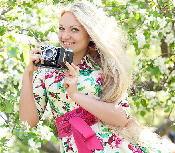 istock Woman with a retro camera 537630538