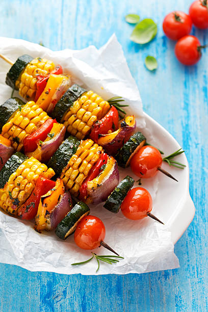 istock Vegetarian skewers with organic vegetables on a white plate 537630924