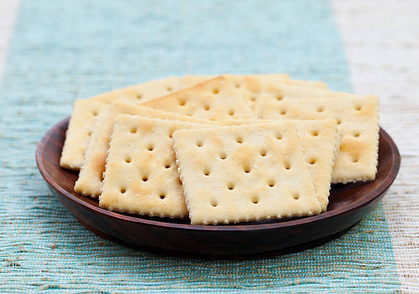 istock Square biscuit cracker in a wooden bowl 537634364