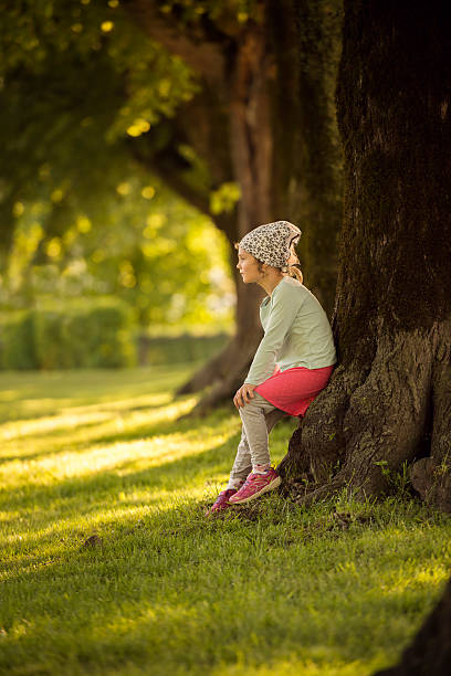 istock littel 6 year old girl in a park 537634720