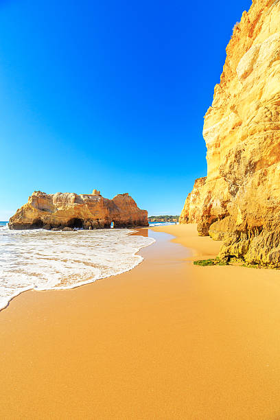 View of beach in Algarve region, Portugal A view of a Praia da Rocha in Portimao, Algarve region, Portugal benagil photos stock pictures, royalty-free photos & images