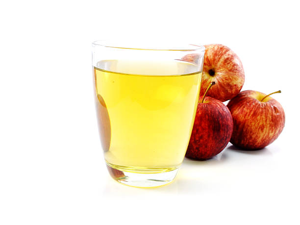 istock glass of apple juice with red apple isolated on white 537640916