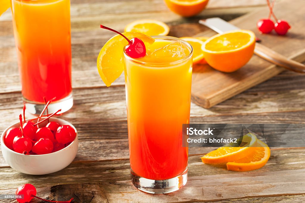 Juicy Orange and Red Tequila Sunrise Juicy Orange and Red Tequila Sunrise with a Cherry Tequila Sunrise Stock Photo Juicy Orange and Red Tequila Sunrise Juicy Orange and Red Tequila Sunrise with a Cherry Tequila Sunrise Stock Photo