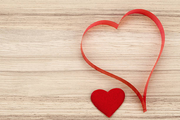 istock valentine's paper hearts on a wooden background 537642363