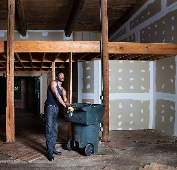 african american workman daydreams in old warehouse