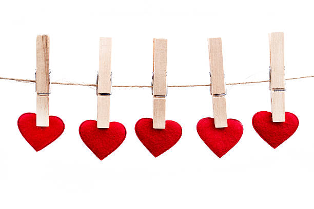 istock Red fabric heart hanging on the clothesline 537642373